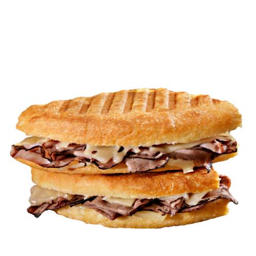Beef panini with roasted beef and salad on toasted bread.